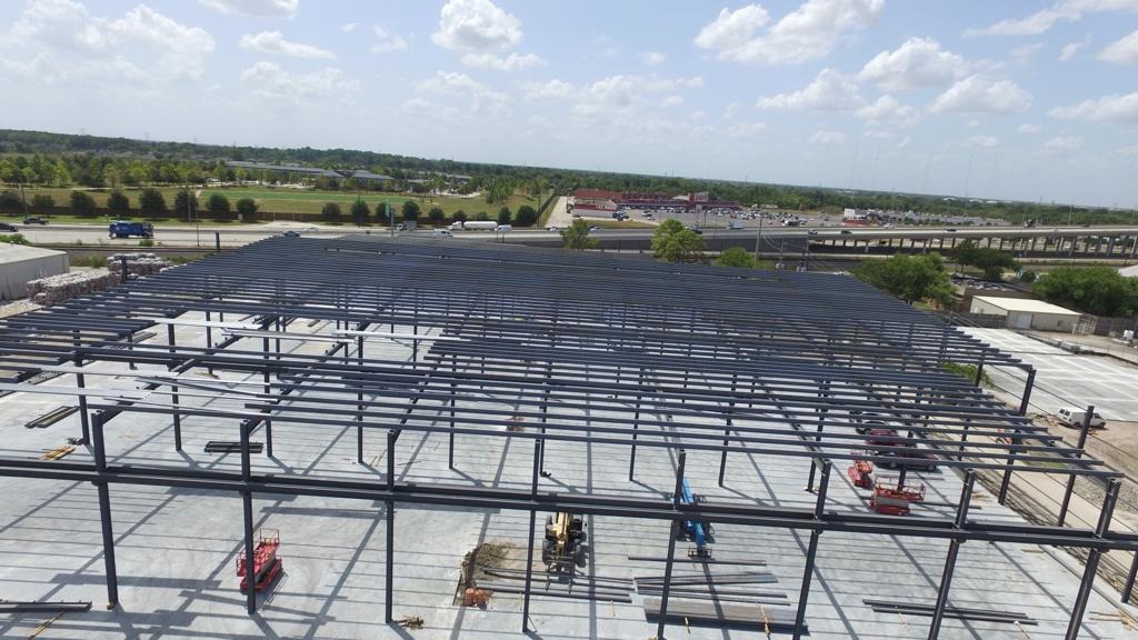 Exterior view of barndominium frame with roof trusses